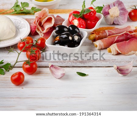 italian appetizer - Mixed Antipasto on a wooden table . Selective focus