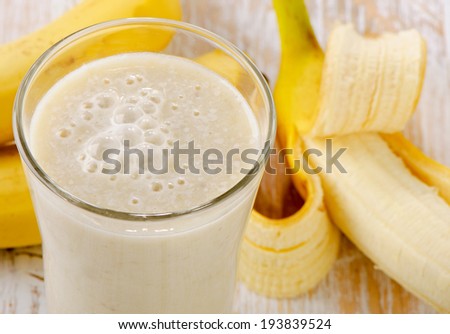 Banana Smoothie on a wooden table. Selective focus