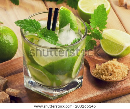 Mojito cocktail and fresh ingredients. Selective focus