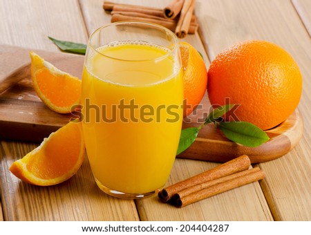 Glass of  orange juice with sliced orange. Selective focus