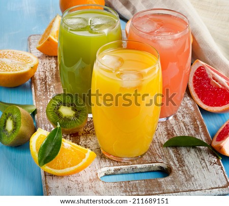 Fresh citrus juices in glasses. Selective focus