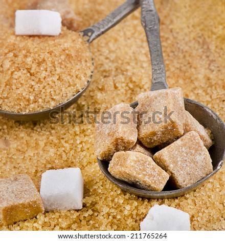 Brown sugar on wooden table. Selective focus