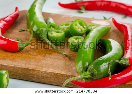 Hot Chili Peppers on a  wooden table. Selective focus