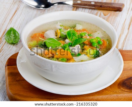 Soup  with chicken and  vegetables . Selective focus