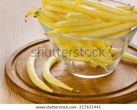 yellow beans on a wooden table. Selective focus