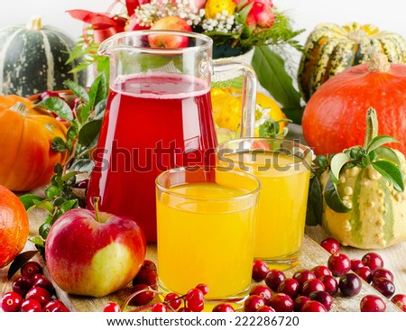 Autumn still life with juice, fruit, berries and vegetables. Selective focus