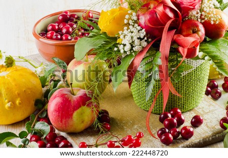 Autumn still life with flowers and fruits . Selective focus