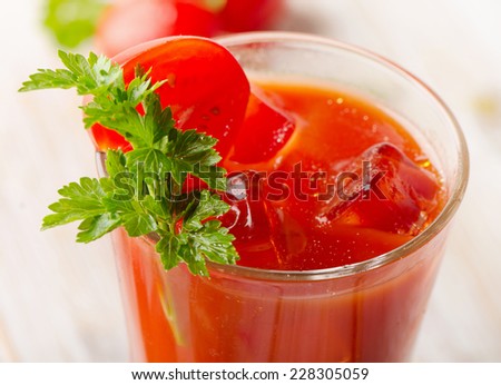 Tomato Cocktail  with   fresh herbs and ice. Selective focus