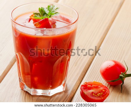Tomato Cocktail  on a wooden table. Selective focus