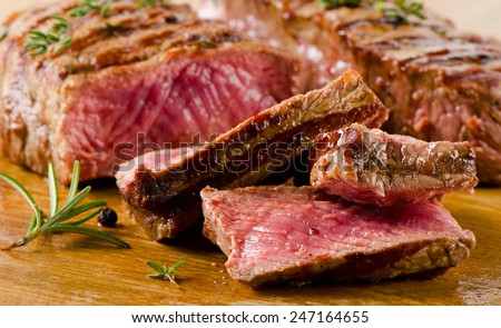Beef  steak on    cutting board. Selective focus