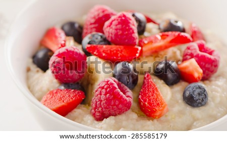 Oatmeal porridge with Berries for  Healthy Breakfast. Selective Focus