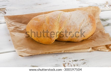 Italian bread ciabatta on a wooden table. Selective focus
