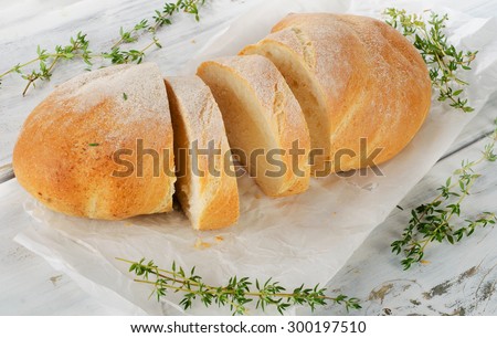 Italian bread ciabatta on a white wooden table