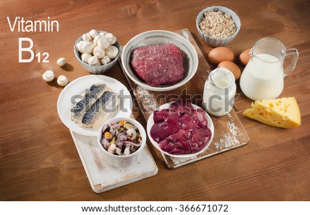 Foods Highest in Vitamin B12 (Cobalamin) on a wooden background. Healthy diet.