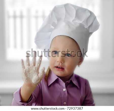 Little girl in chef hat