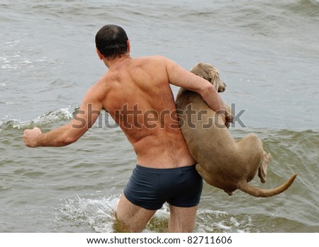 Man and dog in water