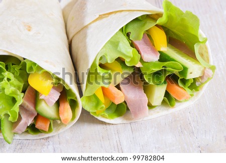Fresh wrap sandwiches filled with ham, lettuce and pepper