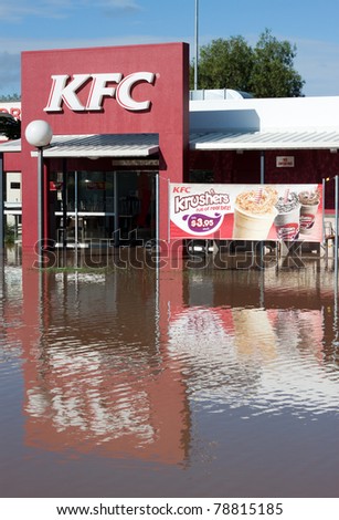 EMERALD, AUSTRALIA - JANUARY 1: A KFC Restaurant is surrounded by flood water on January 1, 2011 in Emerald Australia.  The floods would eventually reach the capital city of Brisbane flooding 28,000 homes.