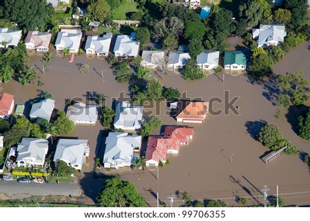 Brisbane Flood JANUARY 2011 Aerial View of homes under water in Australia\'s worst flooding disaster. Also features paddlers surveying damage.