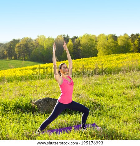 Beautiful woman practicing yoga outside in nature, healthy lifestyle wellness concept