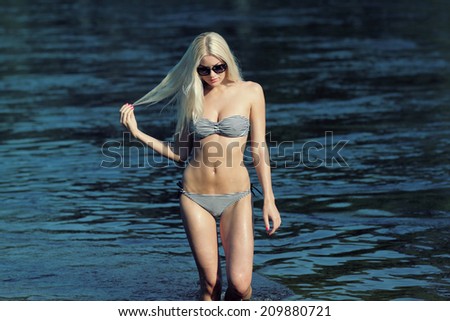 woman in bikini. woman on the ocean coast.