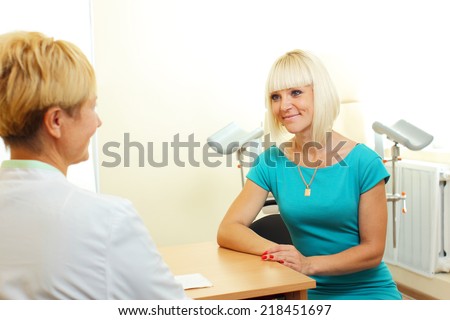 Woman patient talking to a gynecologist gynecology office. Woman in doctor\'s appointment