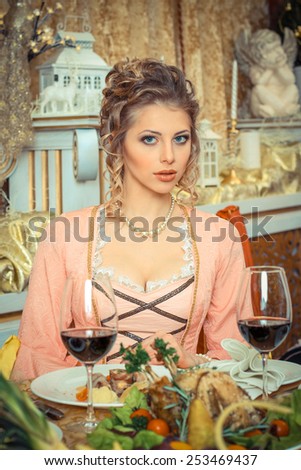 Girl in vintage dress in the restaurant. elegant pretty woman in vintage evening dress waiting alone at the restaurant bar