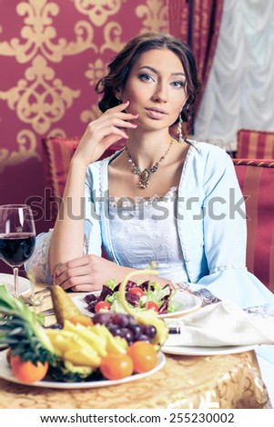 Girl in vintage dress in the restaurant. elegant pretty woman in vintage evening dress. Retro Woman Portrait. Romantic Beauty.Vintage Styled