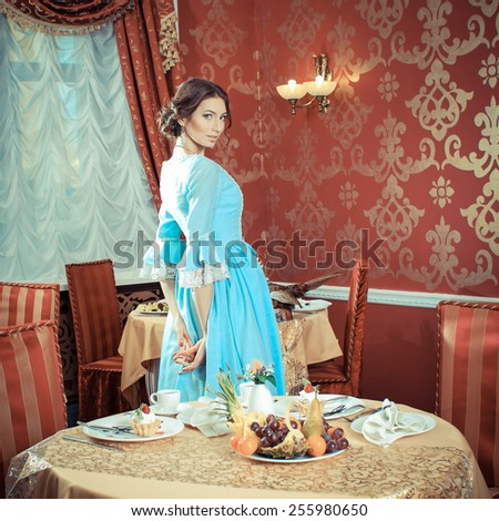 Girl in vintage dress in cafe. elegant pretty woman in vintage evening dress. Retro Woman Portrait. Romantic Beauty.Vintage Styled