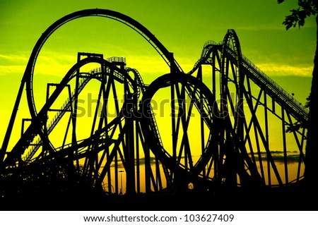 silhouette of a roller coaster at  sunset, after a sunny day