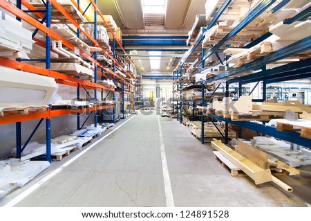 modern warehouse with symmetric rows of shelves interior and colorful shelving system