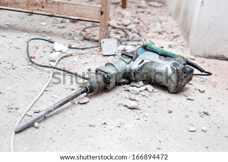 Construction tool, the jackhammer with demolition debris