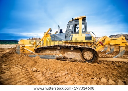 Excavator working and moving earth in construction site, highway road in construction