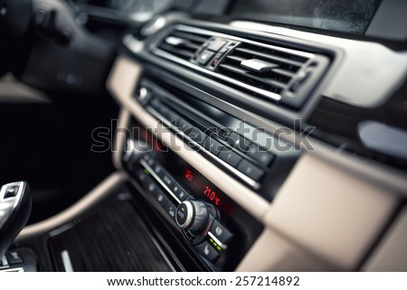 car ventilation system and air conditioning - details and controls of modern car. Concept wallpaper with minimalist industrial design