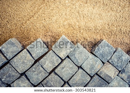 Construction of pavement details, cobblestone pavement, stone blocks on road construction site