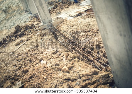 Foundation site of building, details and reinforcements with steel bars and wire rod, preparing for cement pouring