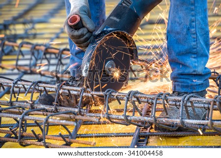 close-up details of construction engineer worker cutting steel bars and reinforced steel at building site