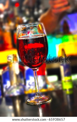 Single glass of wine on the evening bar