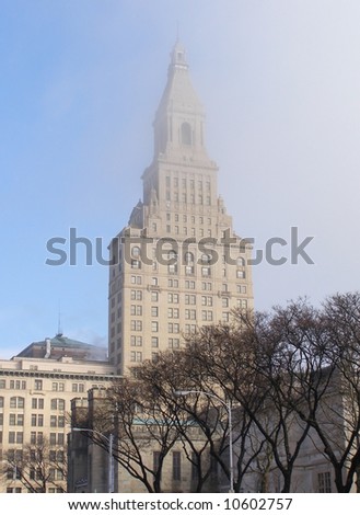 Lifting fog reveals the Travelers Tower in downtown Hartford