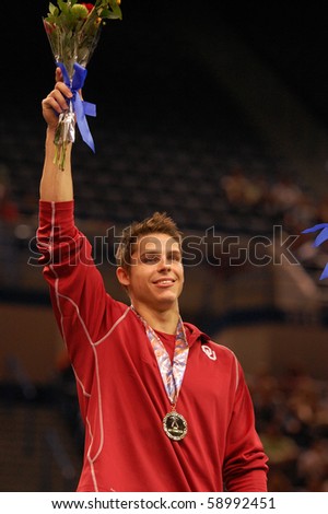 HARTFORD; CT - AUGUST 13: Gymnast Chris Brooks wins the gold medal for high bar at the men\'s competition at the VISA Gymnastics Championships on August 13, 2010 in Hartford, CT.