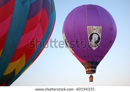 PLAINVILLE, CT - AUGUST 29: A purple hot air balloon with the POW MIA logo rises into the sky during the annual Plainville Hot Air Balloon Festival on August 29, 2010 in Plainville, Connecticut.