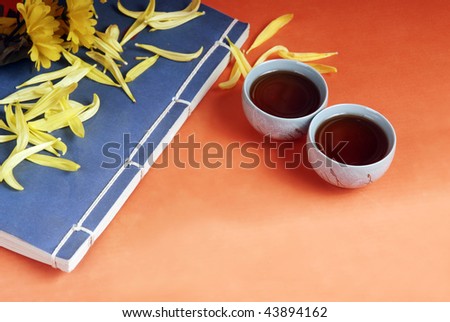 Traditional cups and ancient book