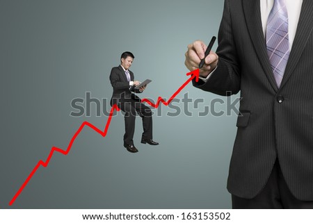 Businessman drawing growth red arrow and another sitting on it, leadership and team work concept