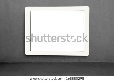Large blank screen hanging on concrete wall
