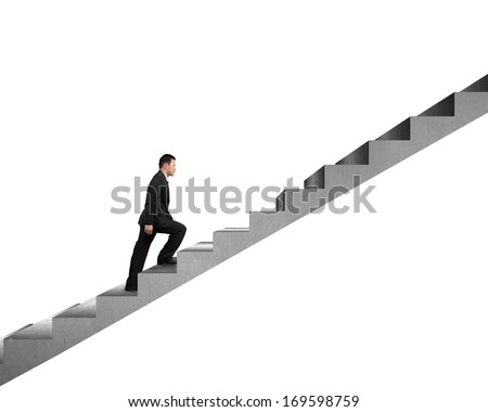 Businessman climbing on concrete stair isolated in white background