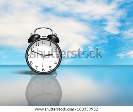 Alarm clock on glass table blue sky background