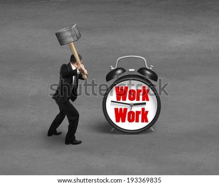 Using sedge hammer hitting alarm clock with work face