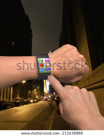 hand wearing ultra-thin curved-screen smart watch with apps and night street background