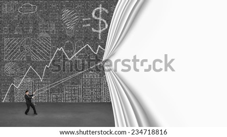 businessman pulling open blank white curtain covering business concept chart doodles on old dark brick wall with gray concrete floor