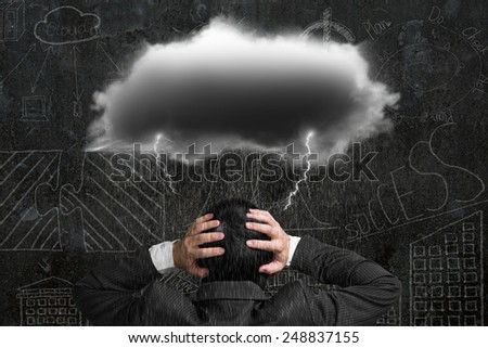 Depressed businessman with dark cloud rain lightning over his head, doodles wall background